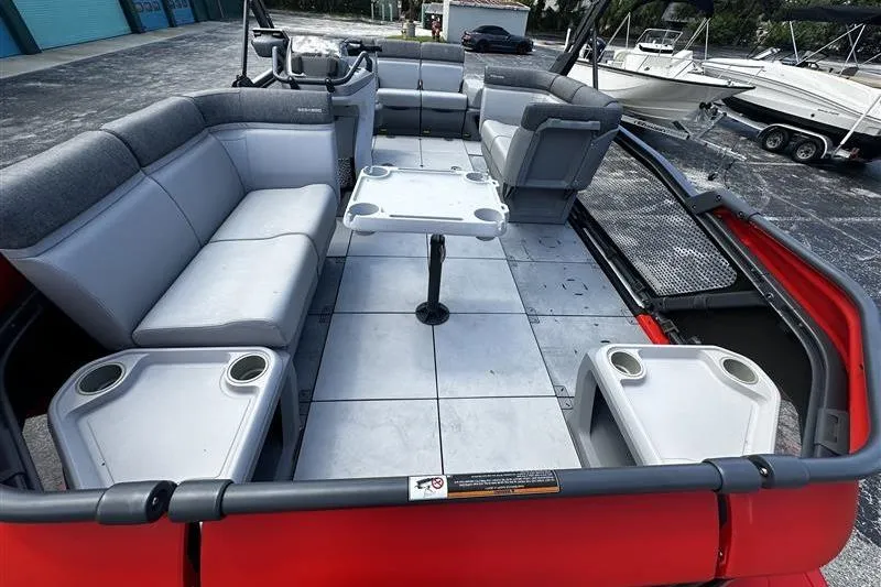 Slide: The Image of 2023 Sea-Doo Switch 16 pontoon boat interior with seating and table. - 6