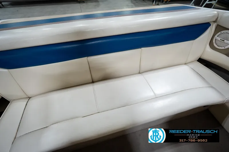 Slide: The Image of White and blue boat seating in a 2000 Bryant 196 Limited. - 21