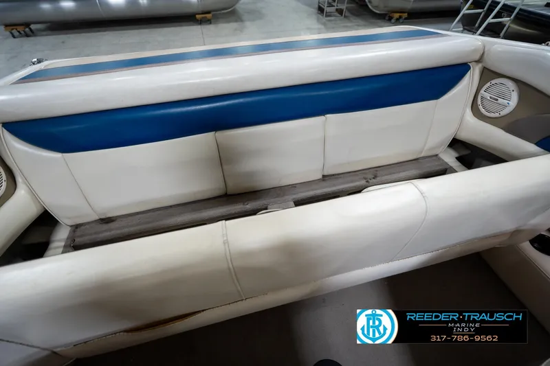 Slide: The Image of Interior seating of a 2000 Bryant 196 Limited boat with blue and white upholstery. - 22