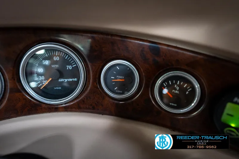 Slide: The Image of Dashboard gauges of a 2000 Bryant 196 Limited boat, featuring speedometer and fuel indicators. - 29