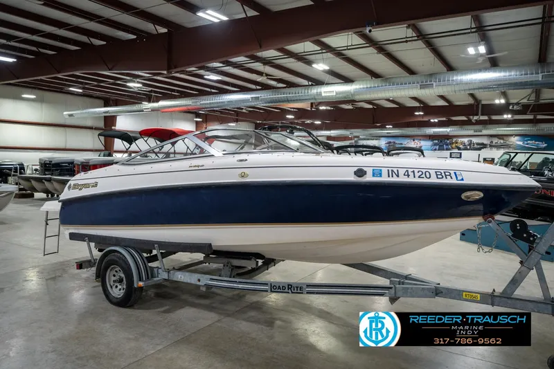 Slide: The Image of 2000 Bryant 196 Limited boat on trailer in indoor showroom. - 3