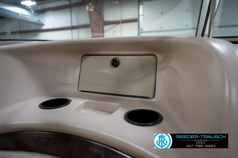 Slide: The Image of Interior of 2000 Bryant 196 Limited boat with glove compartment and cup holders. - 34