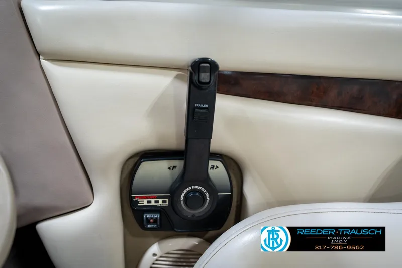 Slide: The Image of Control panel of a 2000 Bryant 196 Limited boat with throttle lever. - 36