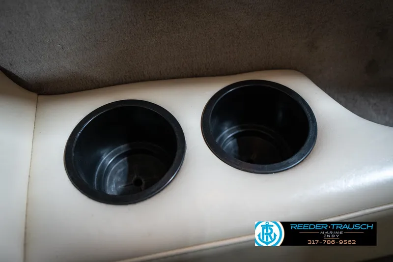 Slide: The Image of Dual cup holders in a 2000 Bryant 196 Limited boat interior. - 41