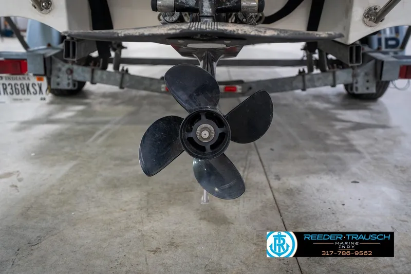 Slide: The Image of Propeller of a 2000 Bryant 196 Limited boat on a trailer in a garage. - 46