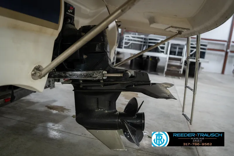 Slide: The Image of 2000 Bryant 196 Limited boat stern drive in a garage setting. - 47