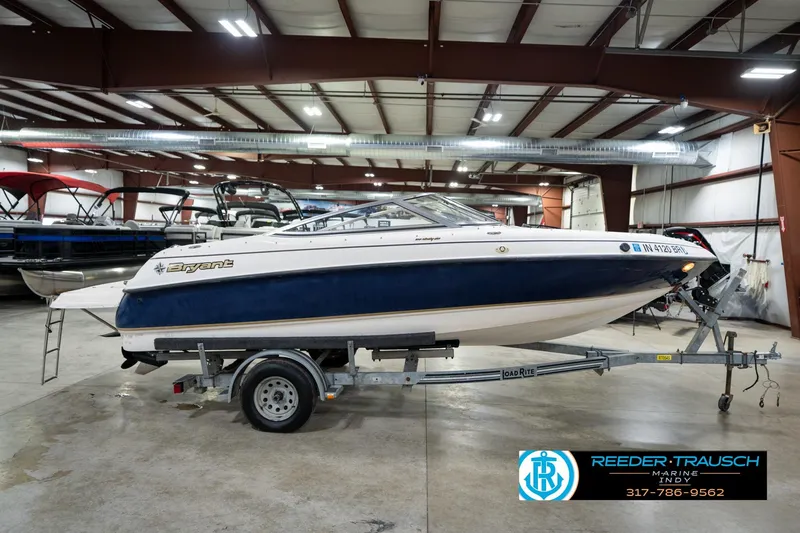 Slide: The Image of 2000 Bryant 196 Limited boat on trailer in indoor showroom. - 5