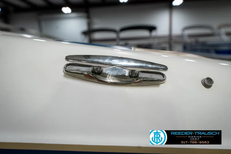 Slide: The Image of Close-up of a 2000 Bryant 196 Limited boat cleat in a showroom. - 54