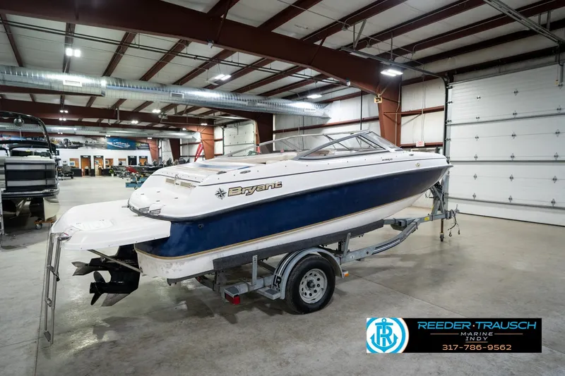 Slide: The Image of 2000 Bryant 196 Limited boat on trailer in indoor showroom, Reeder Trausch Marine. - 6