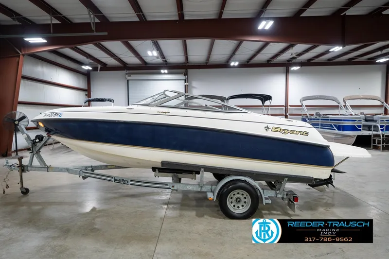 Slide: The Image of 2000 Bryant 196 Limited boat on trailer in indoor storage facility. - 9