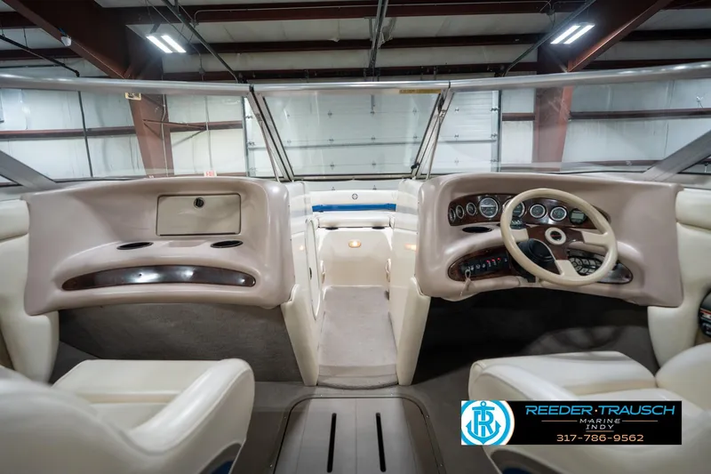 Slide: The Image of Interior view of a 2000 Bryant 196 Limited boat, featuring dashboard and steering wheel. - 18