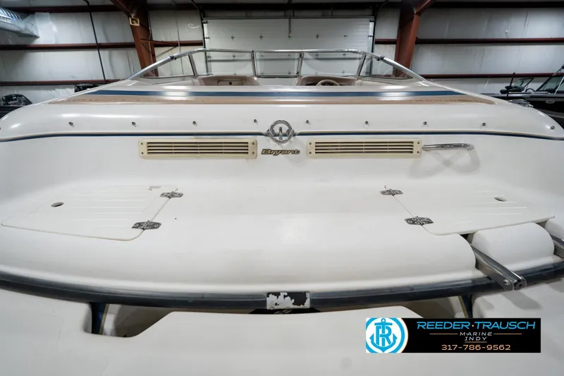 Slide: The Image of 2000 Bryant 196 Limited boat rear view in indoor storage facility. - 23