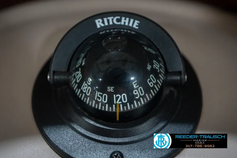 Slide: The Image of Ritchie compass on a 2000 Bryant 196 Limited boat, featuring Reeder-Trausch Marine logo. - 31