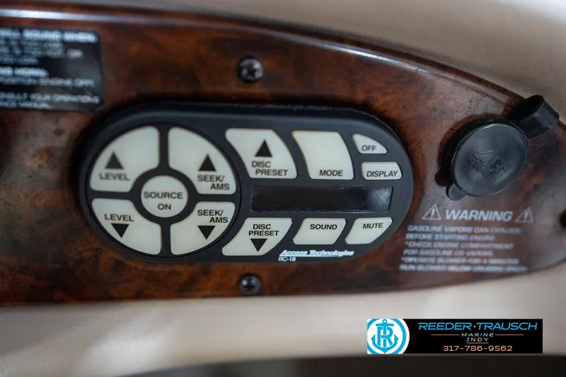 Slide: The Image of Control panel of a 2000 Bryant 196 Limited boat with various audio settings. - 32