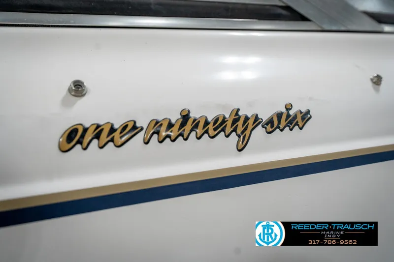 Slide: The Image of Close-up of 'one ninety six' emblem on 2000 Bryant 196 Limited boat. - 51