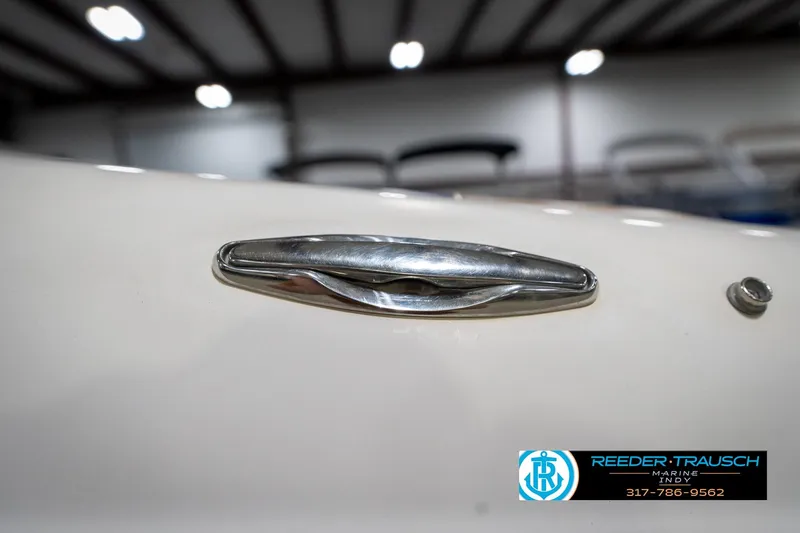 Slide: The Image of Close-up of a 2000 Bryant 196 Limited boat cleat in a showroom. - 53