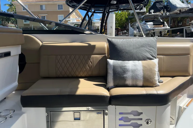 Slide: The Image of Luxurious seating on 2020 Sea Ray 280 SLX boat with plush cushions and elegant design. - 13