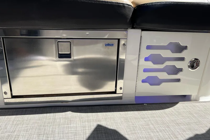 Slide: The Image of 2020 Sea Ray 280 SLX boat interior with stainless steel storage compartment and modern design elements. - 14