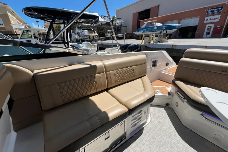 Slide: The Image of 2020 Sea Ray 280 SLX boat interior with tan leather seating and modern design. - 15