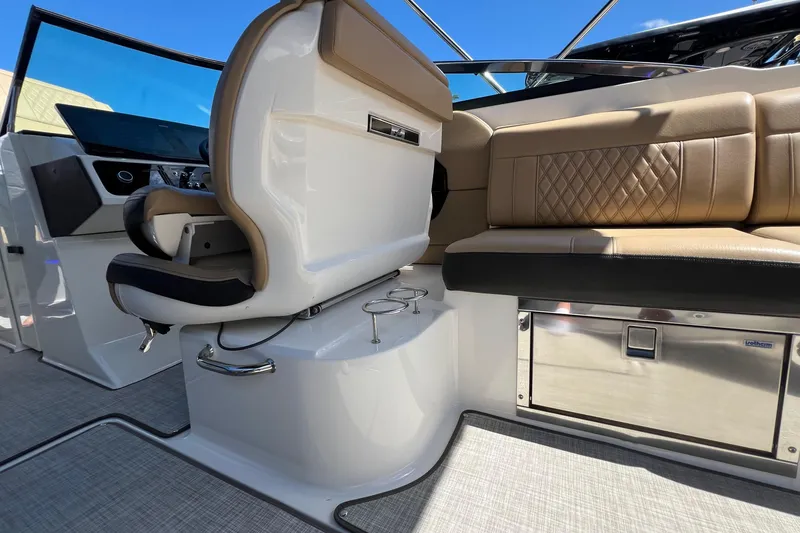 Slide: The Image of 2020 Sea Ray 280 SLX boat interior with luxurious seating and modern dashboard. - 18