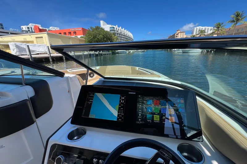 Slide: The Image of Cockpit view of 2020 Sea Ray 280 SLX boat with navigation display on water. - 21