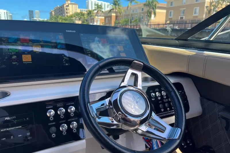 Slide: The Image of Steering wheel and dashboard of 2020 Sea Ray 280 SLX boat with digital displays. - 22