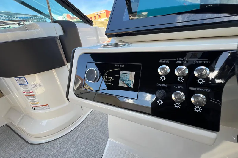 Slide: The Image of Control panel of 2020 Sea Ray 280 SLX boat with navigation and lighting controls. - 23