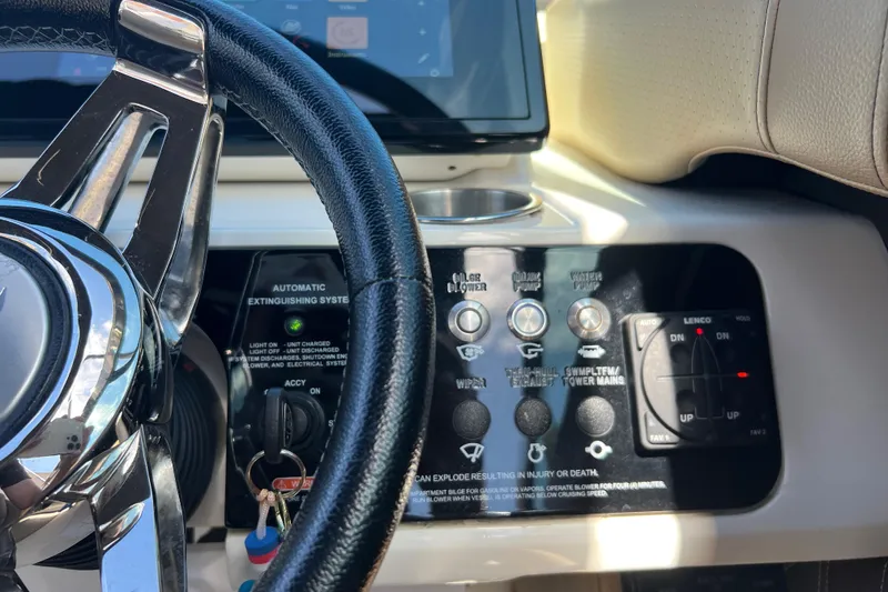 Slide: The Image of 2020 Sea Ray 280 SLX dashboard with steering wheel and control panel. - 24