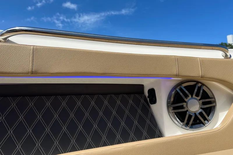 Slide: The Image of 2020 Sea Ray 280 SLX boat interior with speaker and diamond-stitched upholstery. - 34