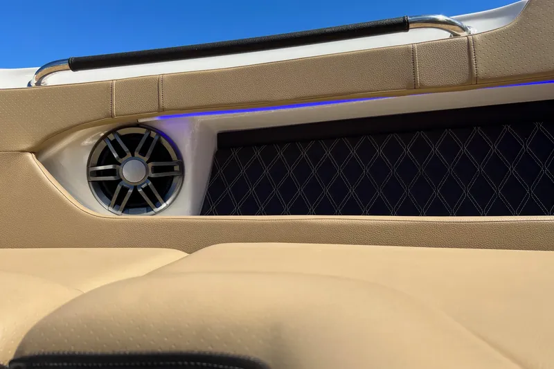 Slide: The Image of 2020 Sea Ray 280 SLX boat interior with speaker and luxurious upholstery. - 36