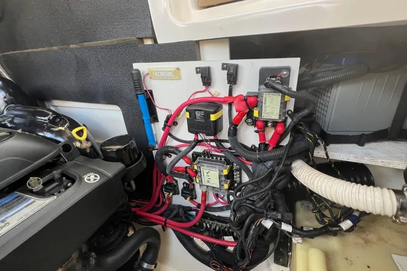 Slide: The Image of Engine compartment of 2020 Sea Ray 280 SLX with wiring and components visible. - 42