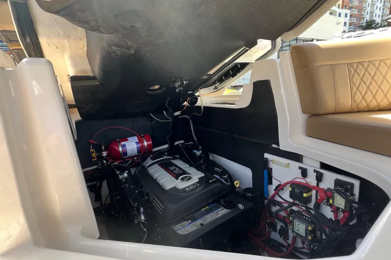 Slide: The Image of Engine compartment of a 2020 Sea Ray 280 SLX boat, showcasing mechanical components. - 44