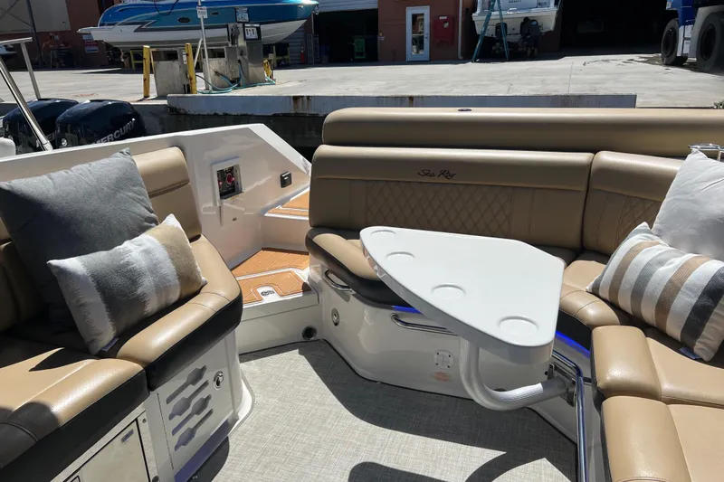 Slide: The Image of Luxurious 2020 Sea Ray 280 SLX boat interior with plush seating and stylish table. - 7