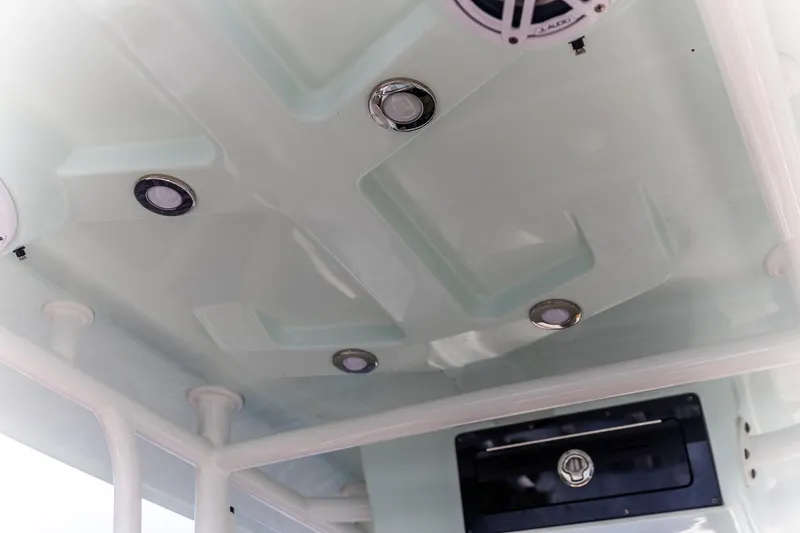 Slide: The Image of 2022 Crevalle 26 HBW boat interior ceiling with built-in lights and speaker. - 21