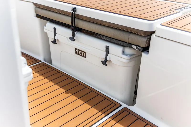 Slide: The Image of 2022 Crevalle 26 HBW boat with Yeti cooler and teak flooring. - 27