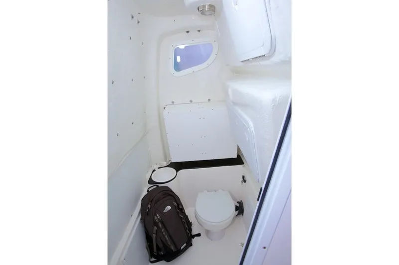 Slide: The Image of Manufacturer Provided Image: 2018 Sea Fox 266 Commander boat interior with toilet and backpack. - 15