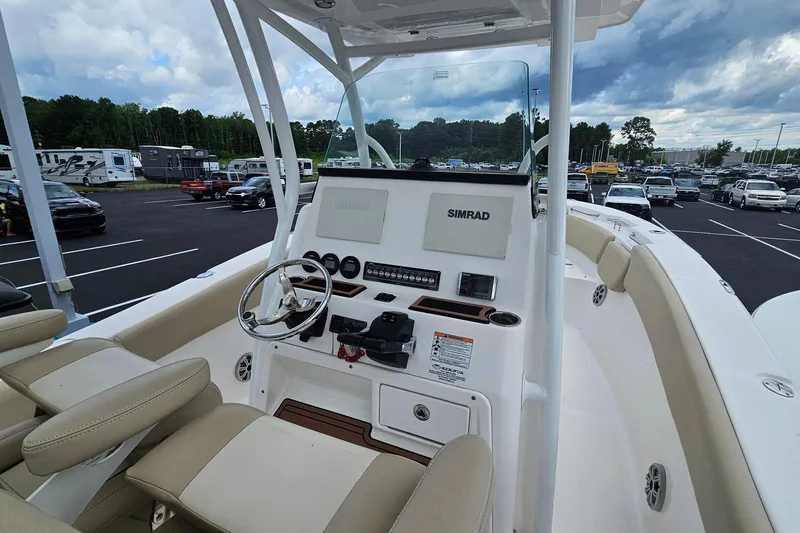 Slide: The Image of 2018 Sea Fox 266 Commander boat interior with steering wheel and control panel. - 4