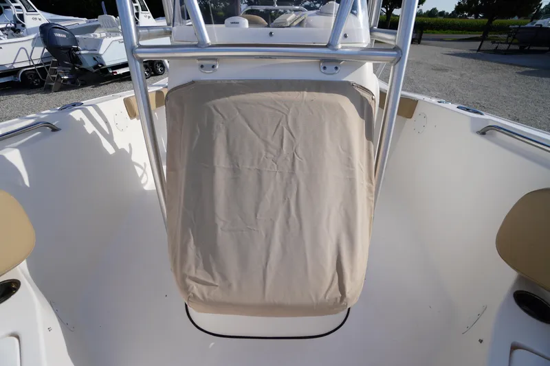 Slide: The Image of 2019 Tidewater 220 LXF boat interior with covered seating and stainless steel frame. - 13