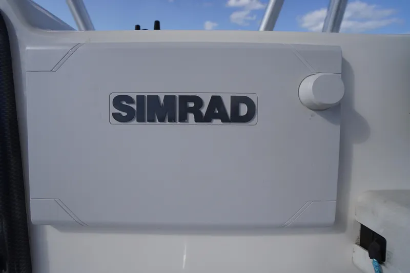 Slide: The Image of Simrad equipment on 2019 Tidewater 220 LXF boat, clear sky background. - 21
