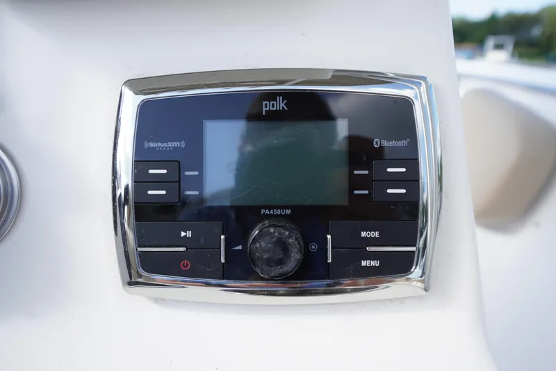Slide: The Image of Polk audio system on 2019 Tidewater 220 LXF boat dashboard. - 22