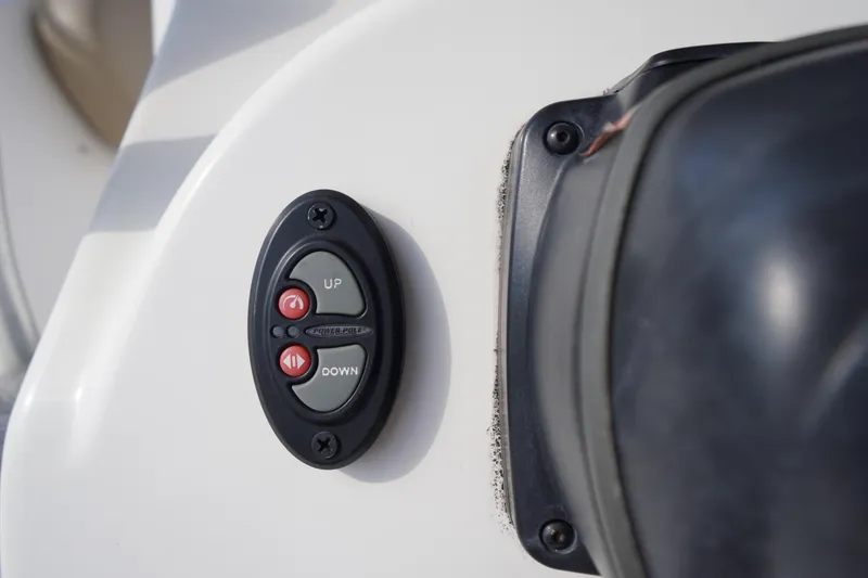 Slide: The Image of Close-up of 2019 Tidewater 220 LXF boat control panel with up and down buttons. - 26