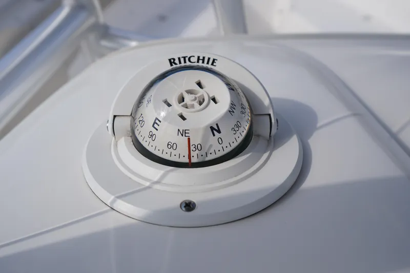 Slide: The Image of Compass on 2019 Tidewater 220 LXF boat dashboard, showing northeast direction. - 27