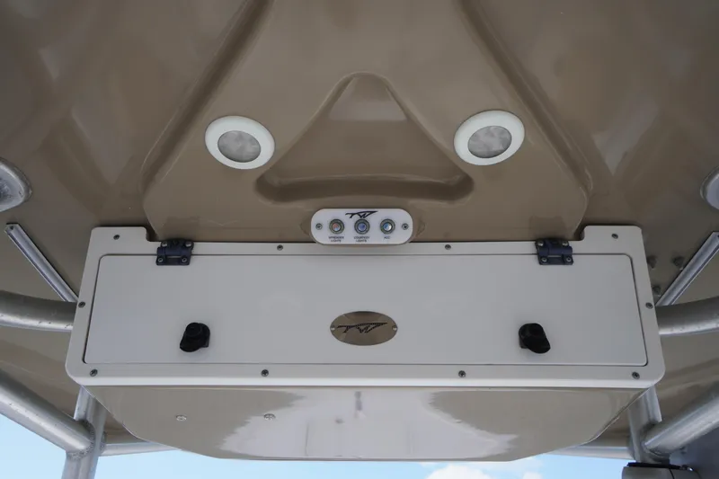 Slide: The Image of 2019 Tidewater 220 LXF boat console with controls and storage compartment. - 30