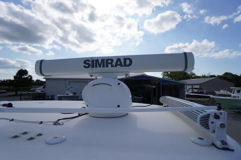 Slide: The Image of 2019 Tidewater 220 LXF boat with Simrad radar system under a cloudy sky. - 32