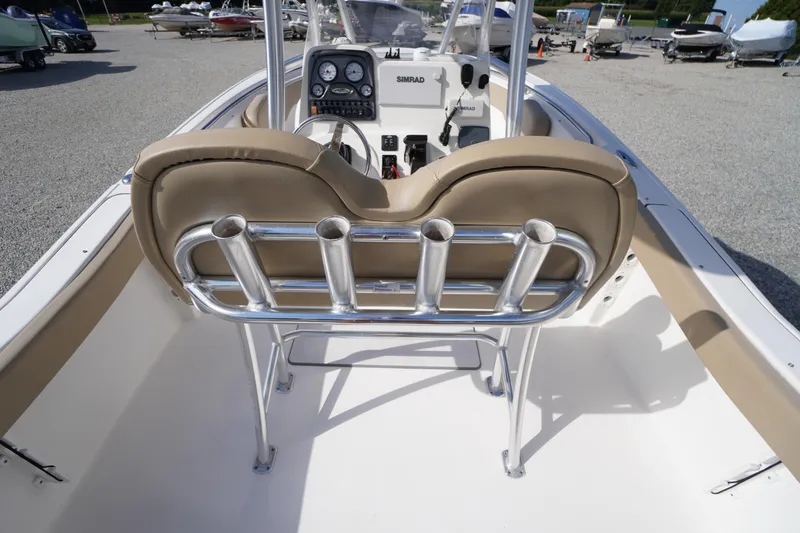 Slide: The Image of 2019 Tidewater 220 LXF boat interior with rod holders and control panel. - 38