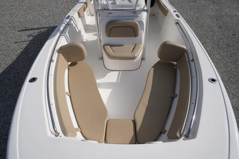 Slide: The Image of 2019 Tidewater 220 LXF boat interior with beige seating and white deck. - 4
