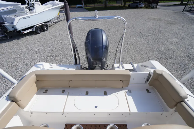 Slide: The Image of 2019 Tidewater 220 LXF boat with Yamaha engine, beige seating, and spacious deck. - 41