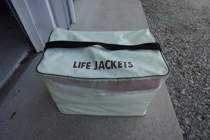 Slide: The Image of Bag labeled "Life Jackets" on concrete, near gravel, for Tidewater 220 LXF 2019. - 52
