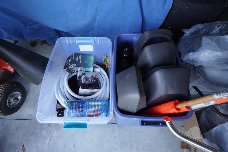 Slide: The Image of Storage bins with boat accessories for 2019 Tidewater 220 LXF, including hoses and fenders. - 54