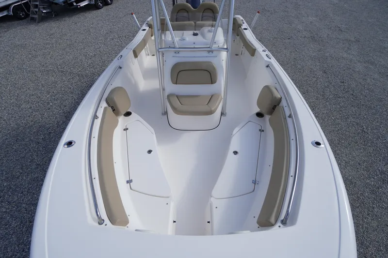 Slide: The Image of 2019 Tidewater 220 LXF boat interior with beige seating and spacious deck layout. - 7
